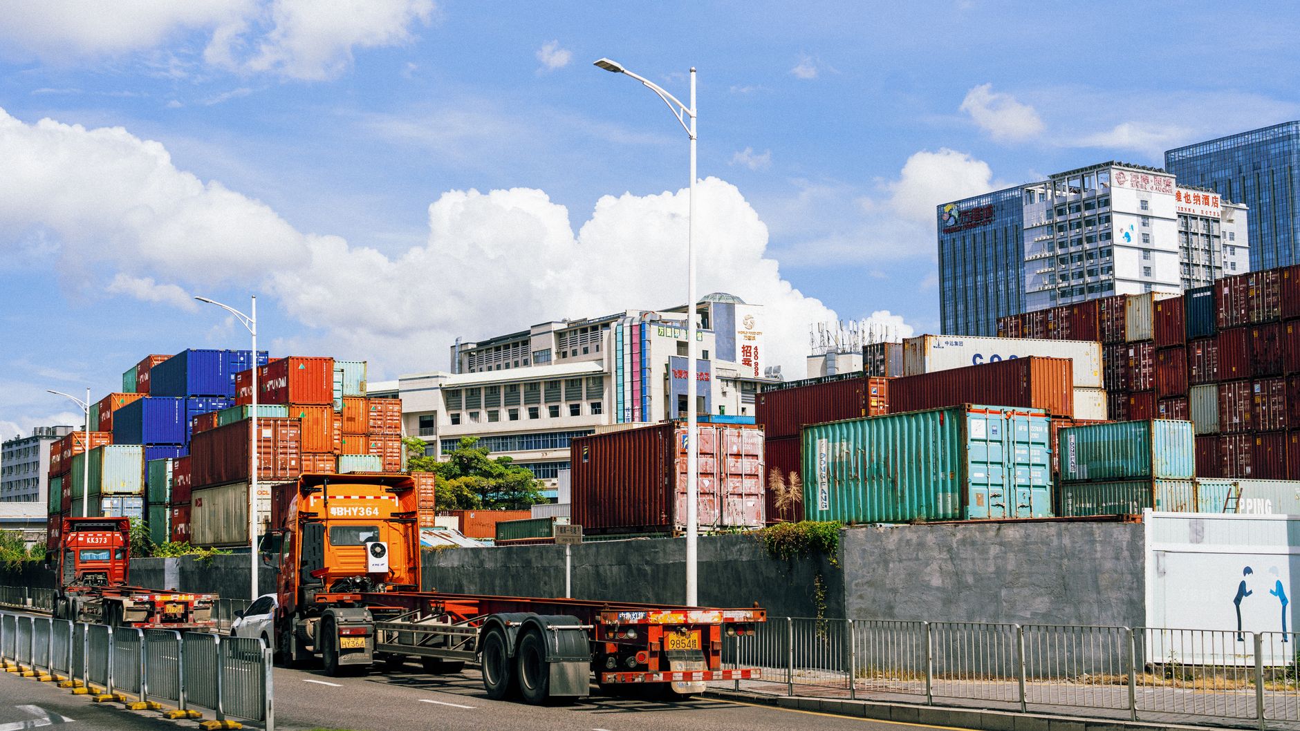 A freight truck and rail container at an intermodal logistics facility