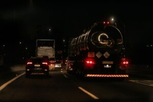 Commercial semi-truck driving on a highway representing the U.S. freight transportation industry