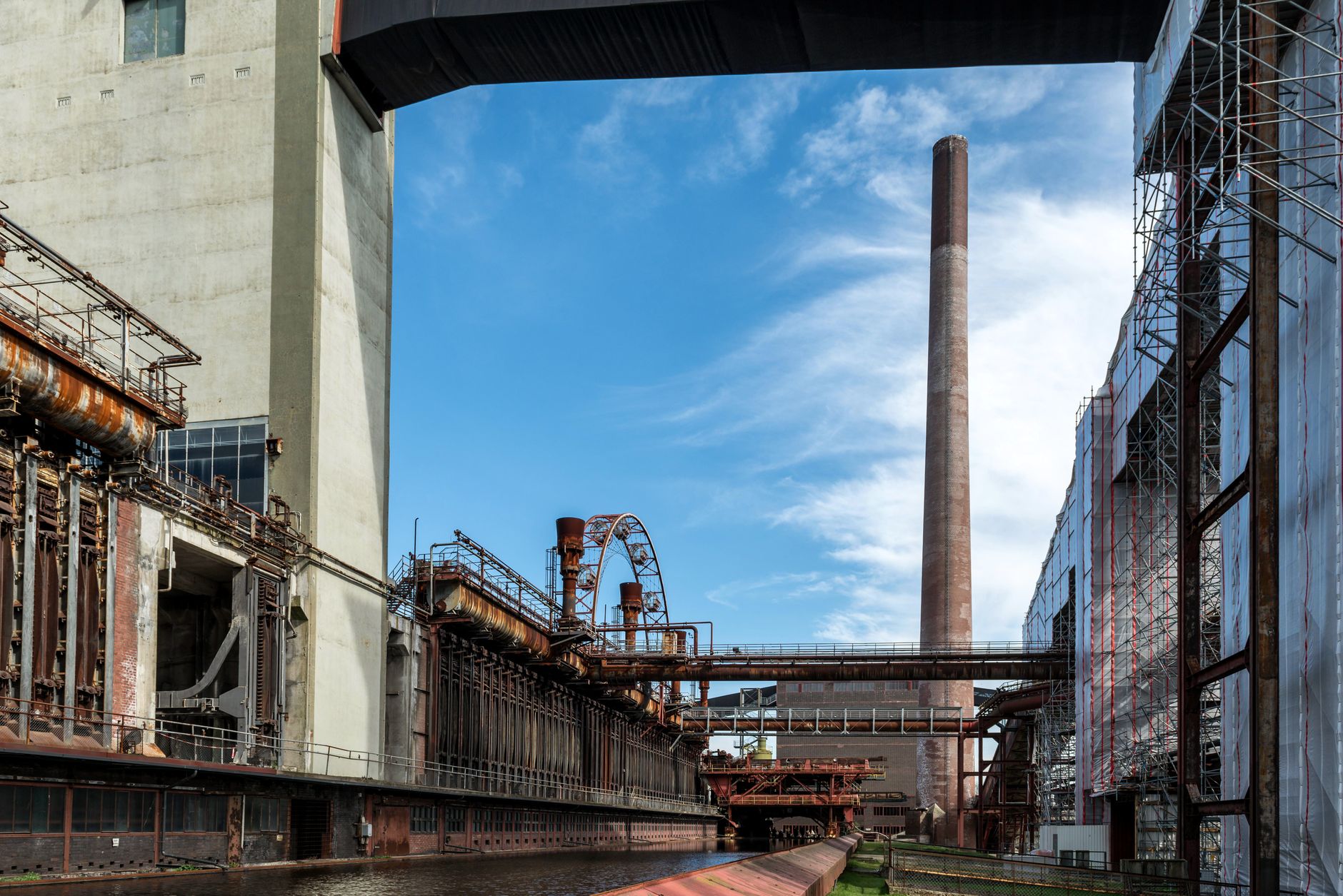 Interior of a steel mill with industrial furnaces and heavy machinery