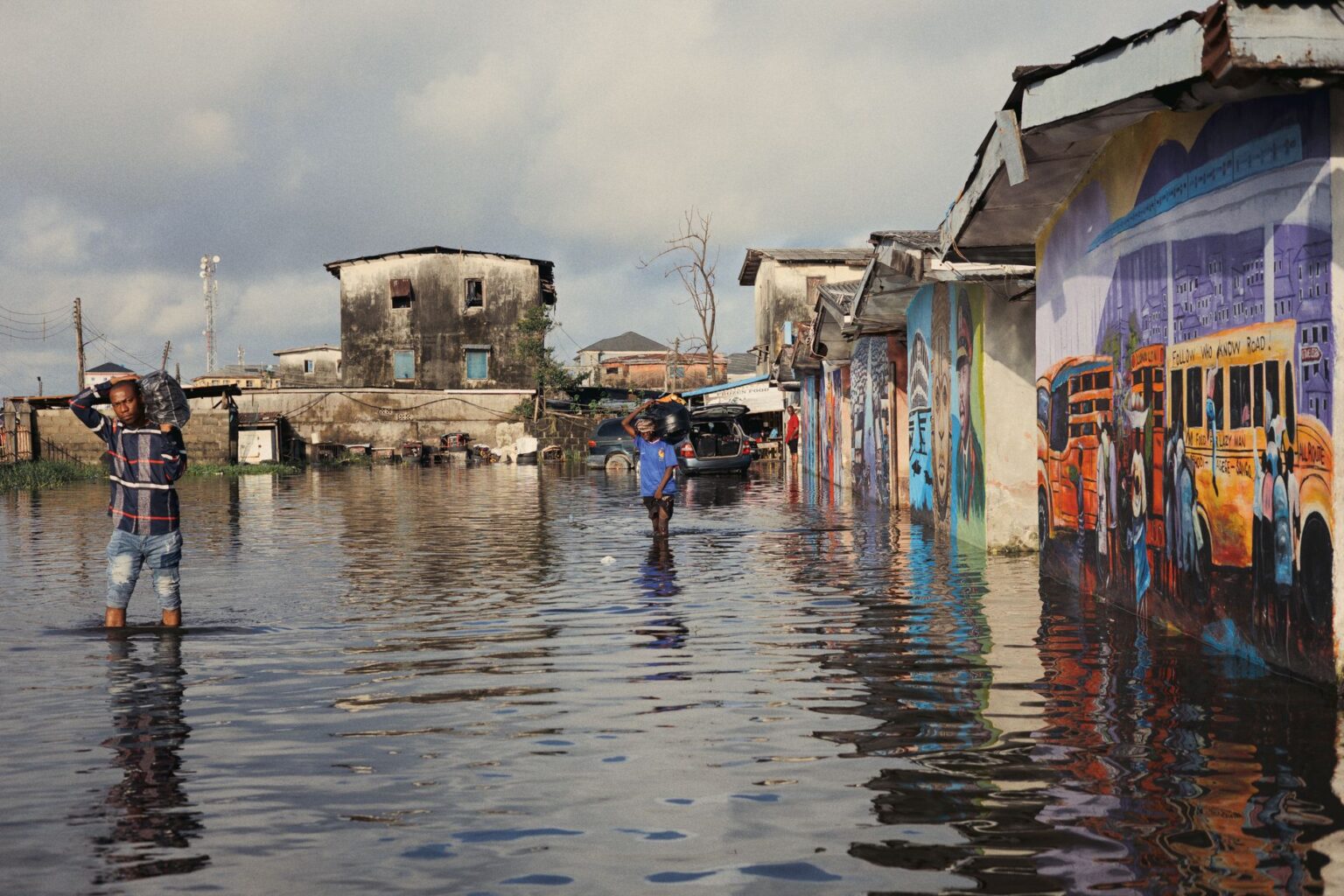 Residential neighborhood street submerged in floodwater after heavy rainfall