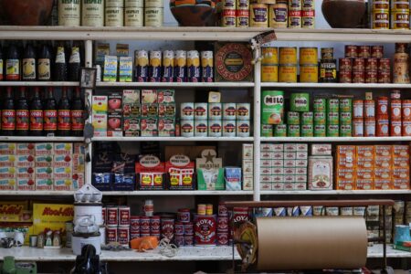 Empty grocery store shelves in the egg aisle during a supply shortage