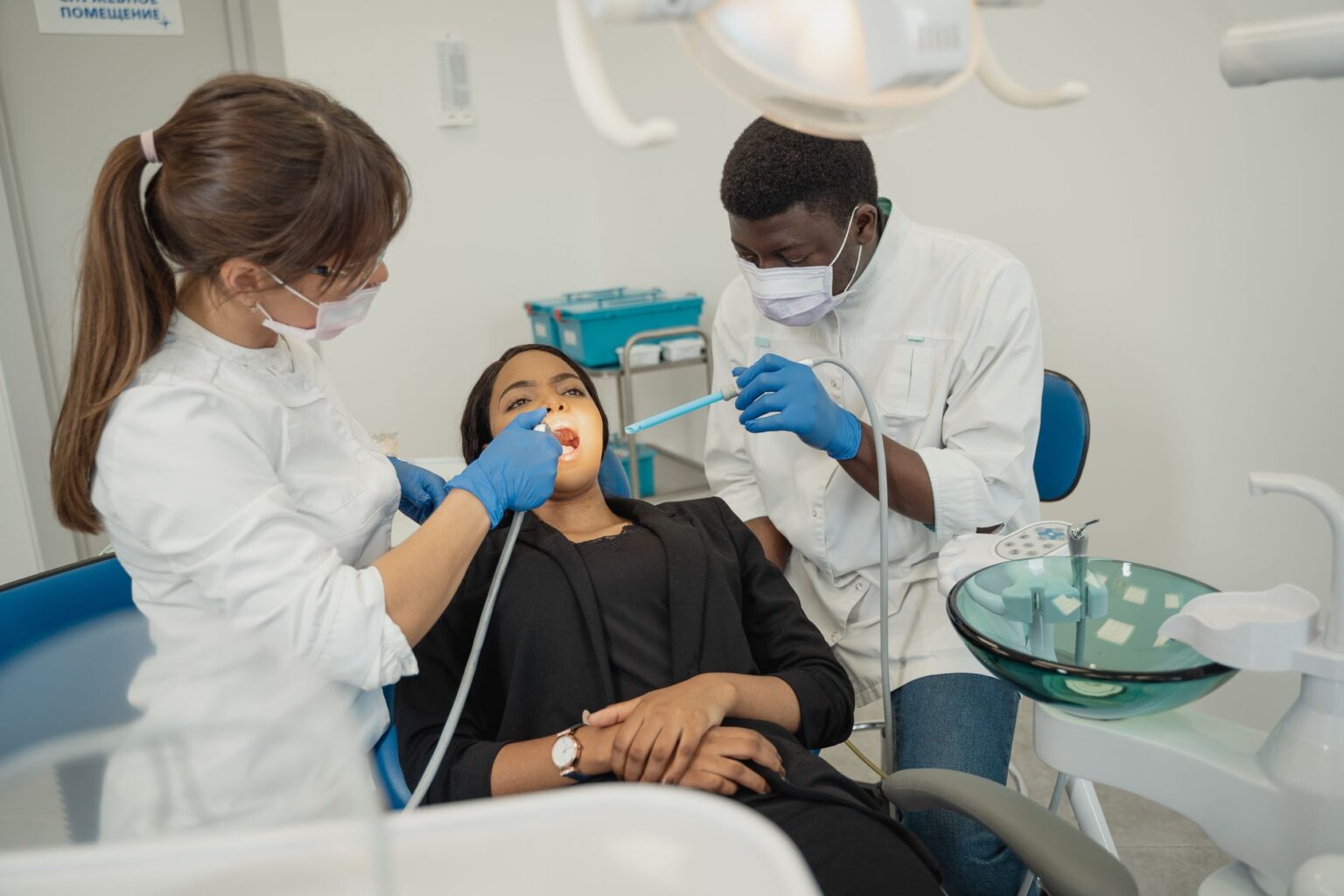 Empty dental clinic chair in a treatment room representing gaps in Medicaid dental access