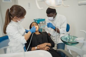 Empty dental clinic chair in a treatment room representing gaps in Medicaid dental access