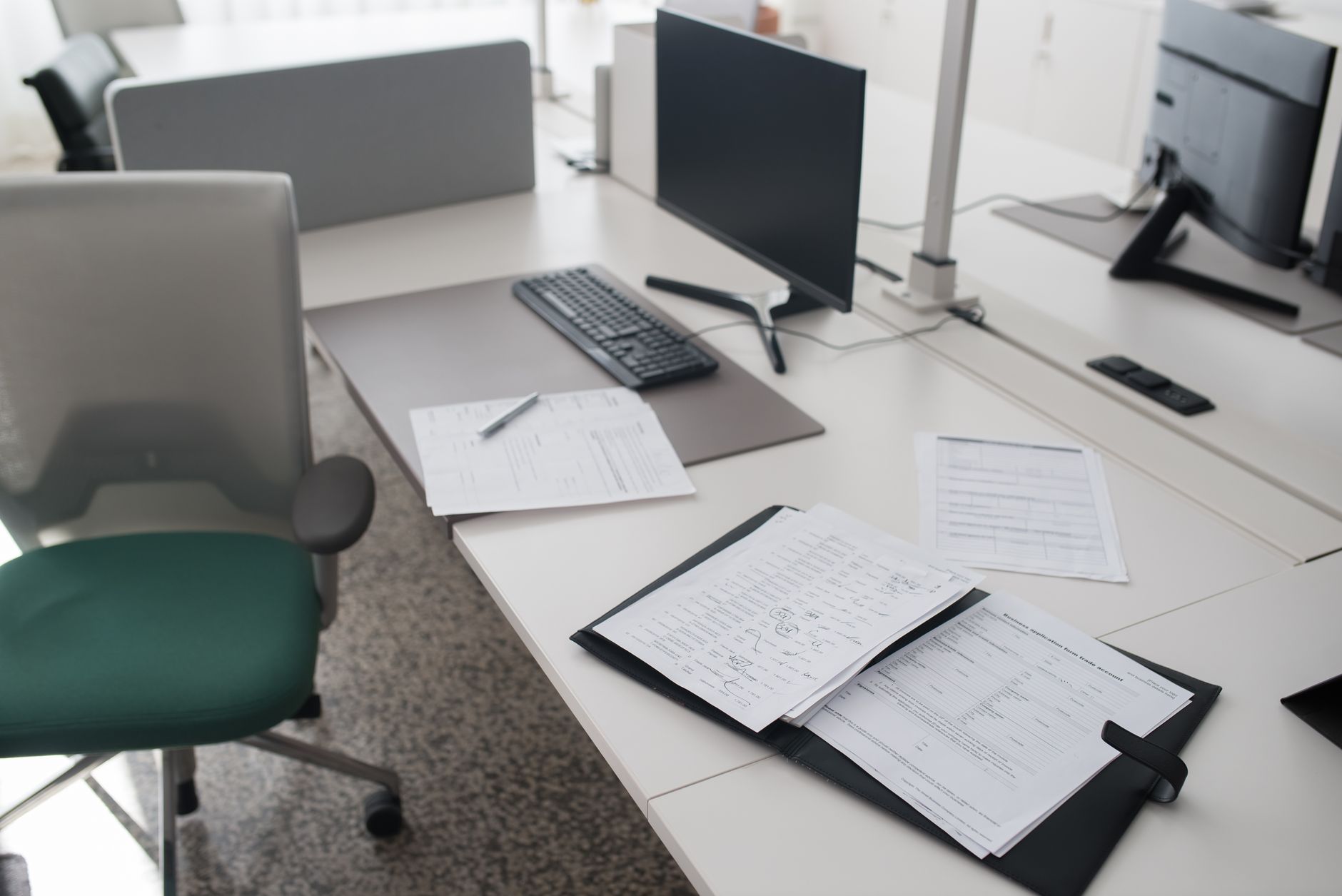 Stack of government forms and documents on a desk, representing Medicaid renewal paperwork burdens