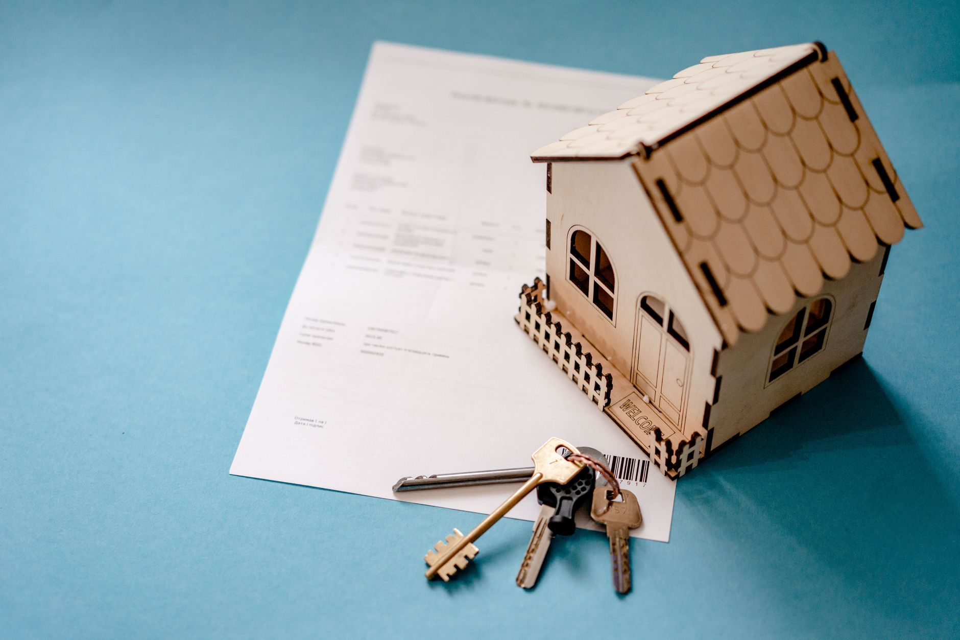 Person reviewing and signing an auto loan document at a desk