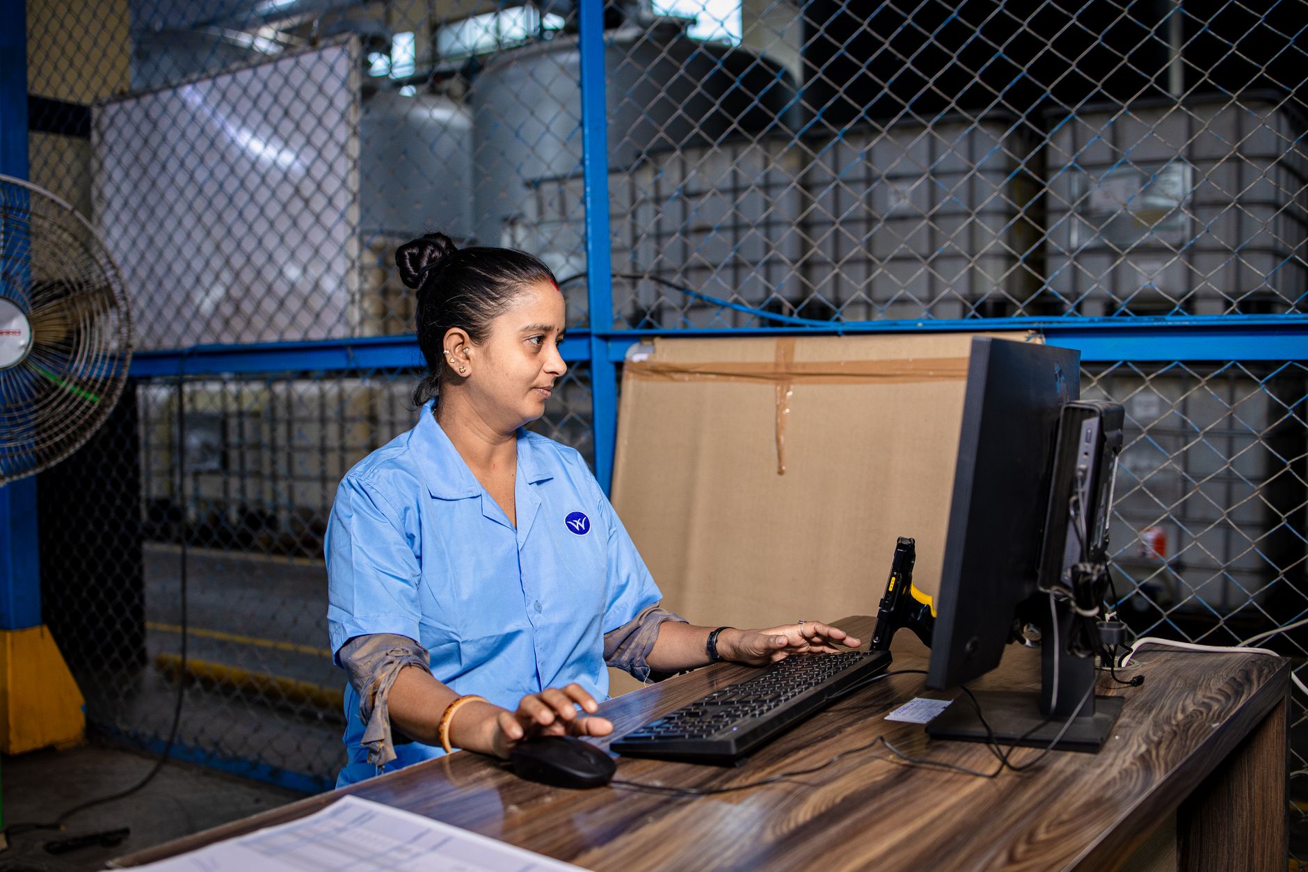 Low-wage warehouse worker representing adults potentially affected by Medicaid work requirements
