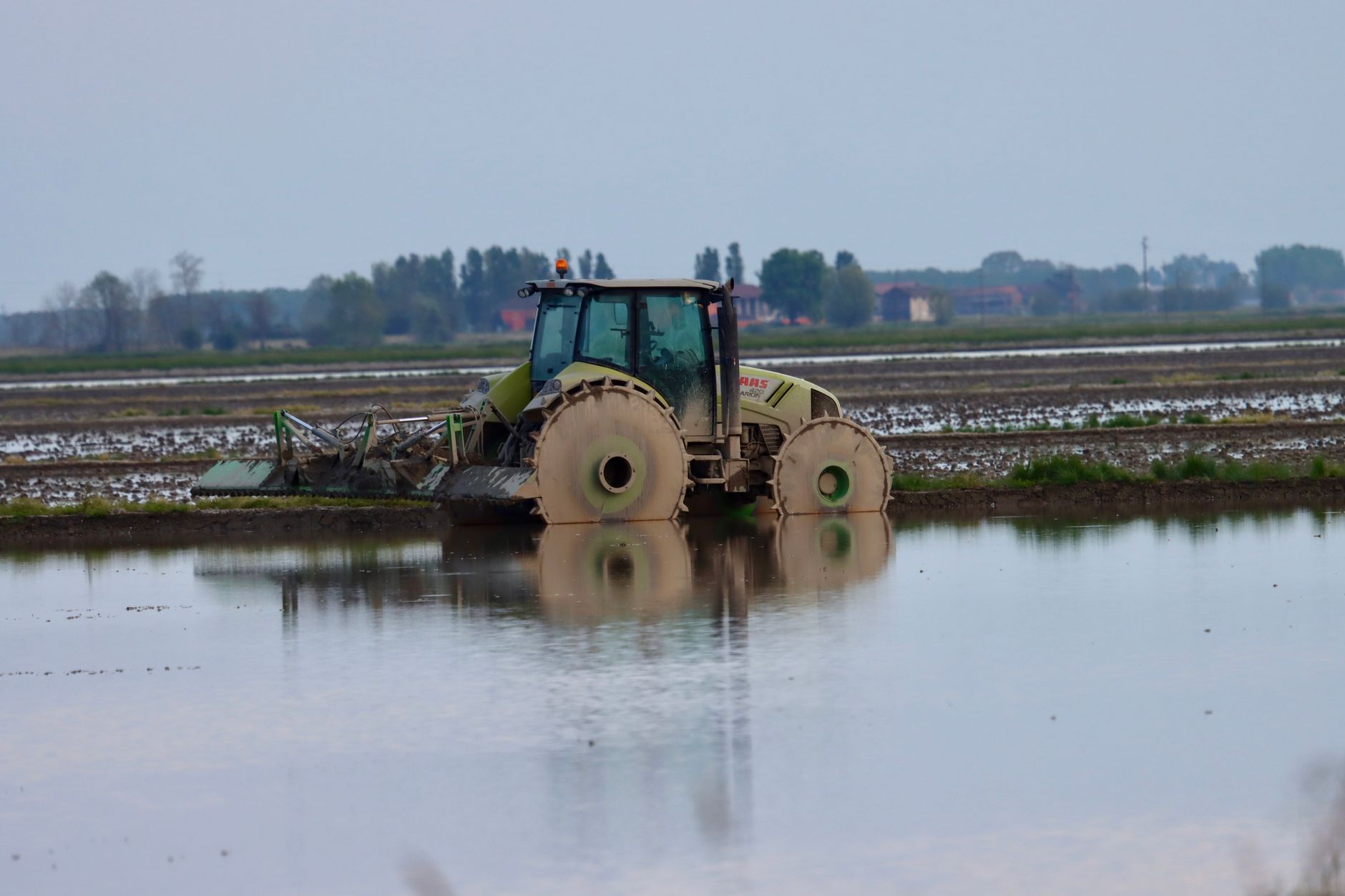 Agricultural fields submerged under floodwater during a severe weather event