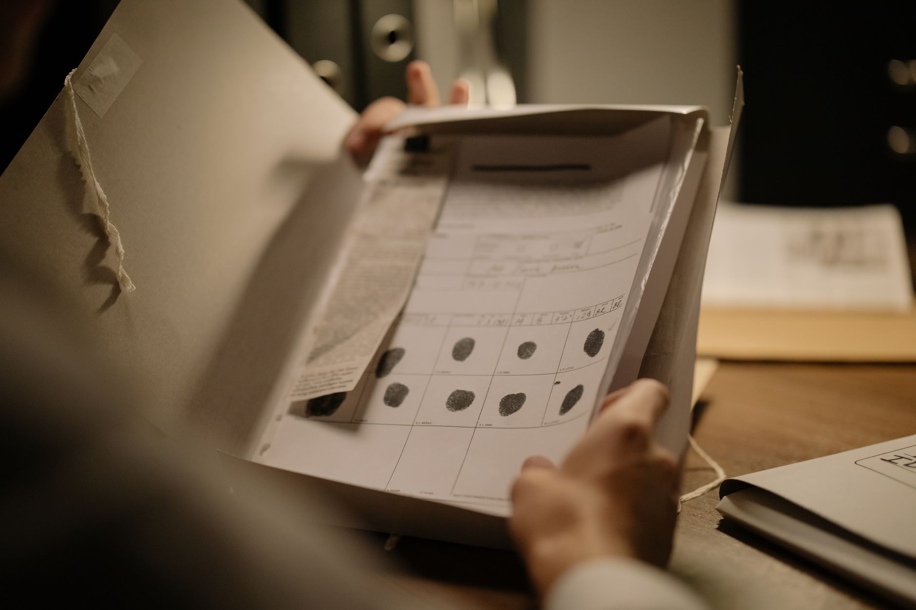 A person reviewing Social Security or federal benefits paperwork at a desk