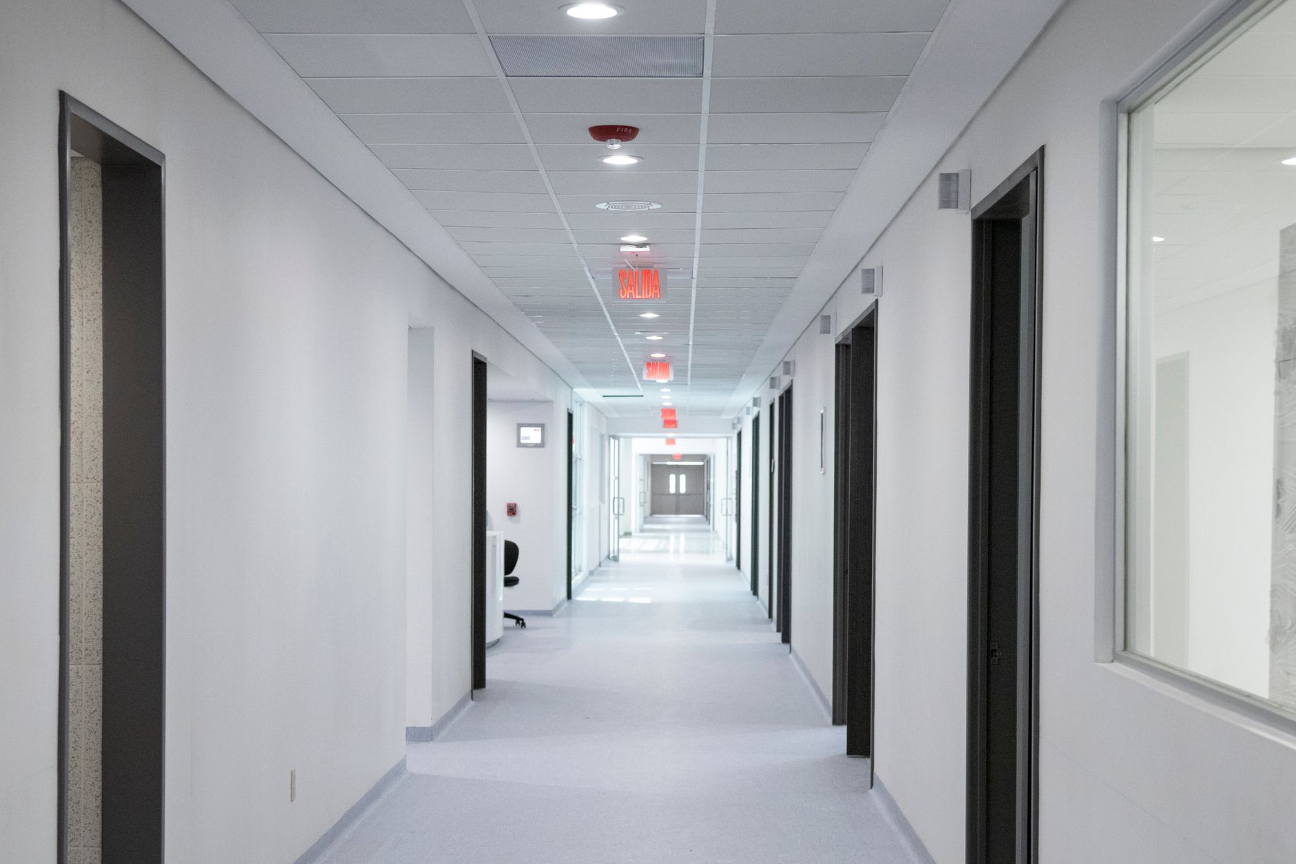 Abandoned or vacant medical clinic interior with closed doors