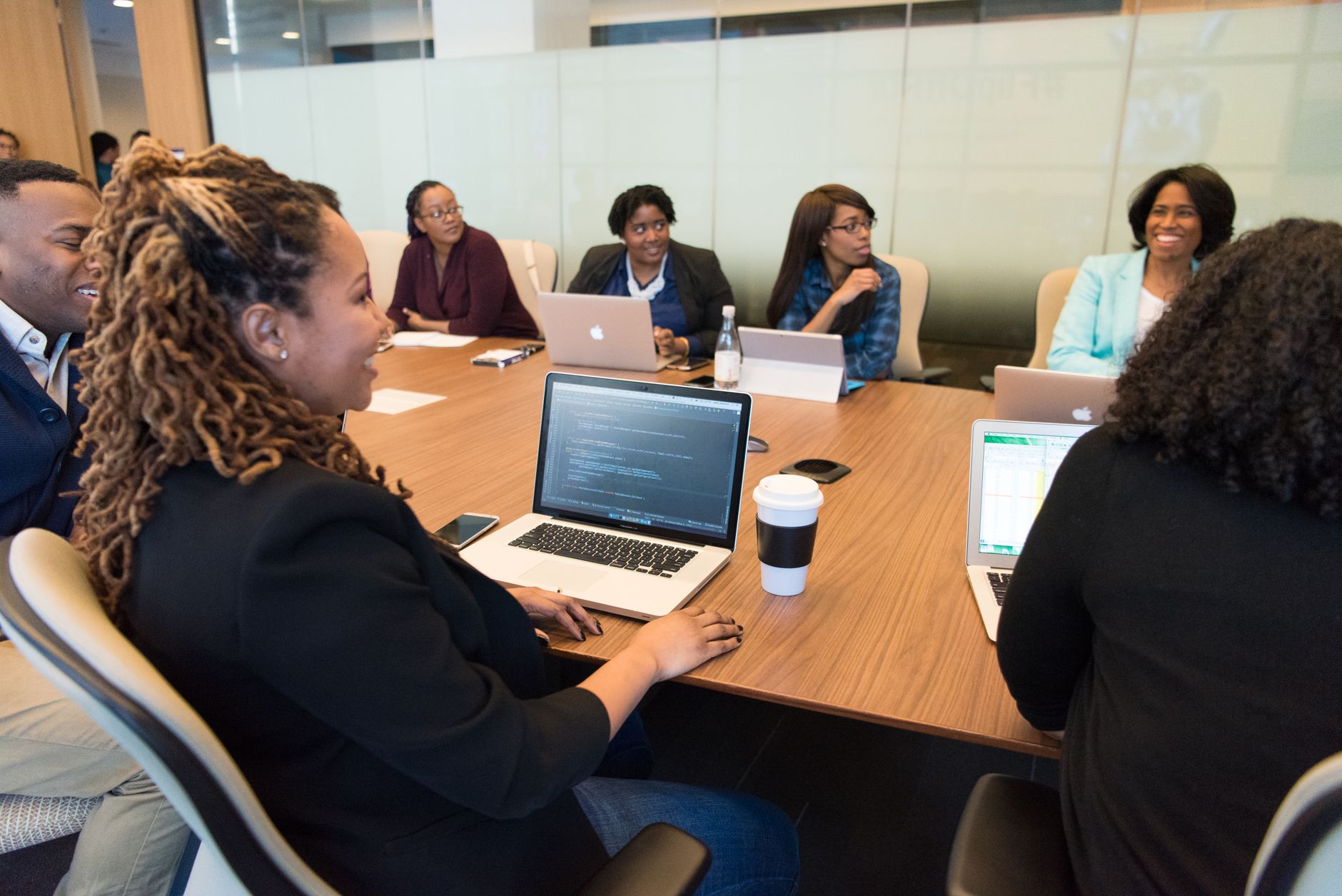 Business executives reviewing documents during a corporate boardroom meeting