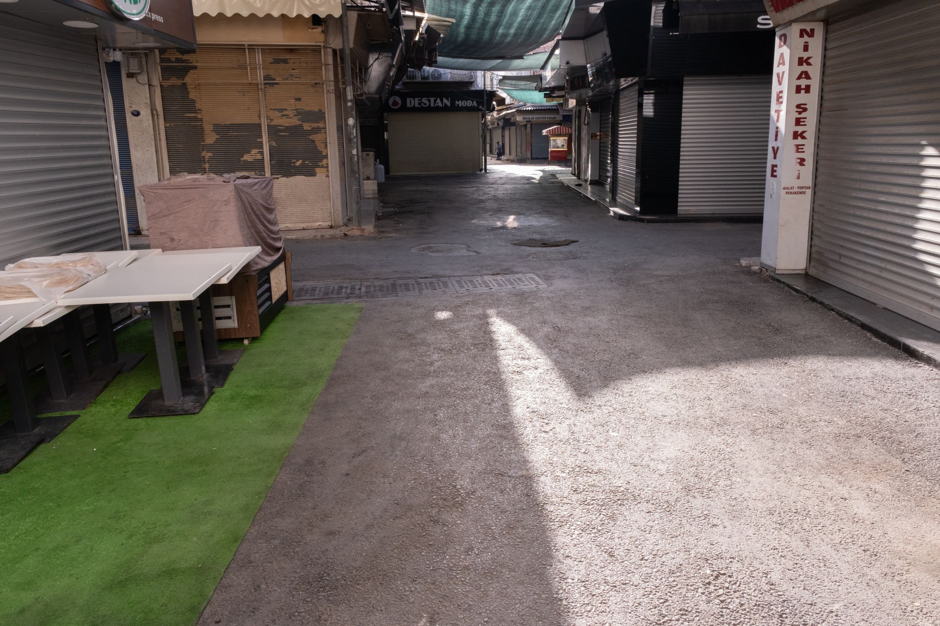 Quiet commercial street in a suburb affected by contractor workforce reductions