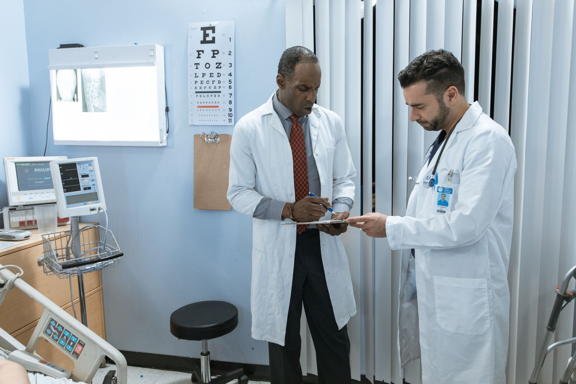 Healthcare administrator reviewing managed care contract documents at a desk