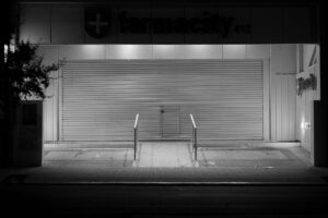 Empty shelves inside a closed retail pharmacy location