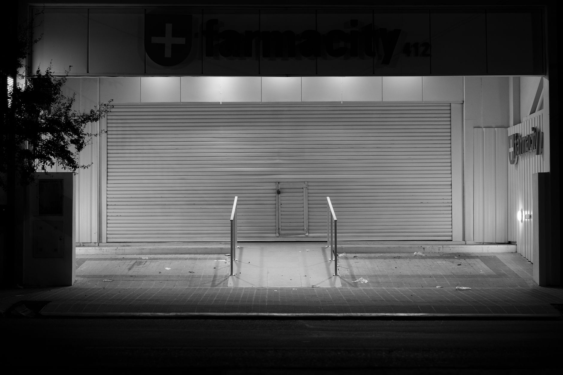 Empty shelves inside a closed retail pharmacy location
