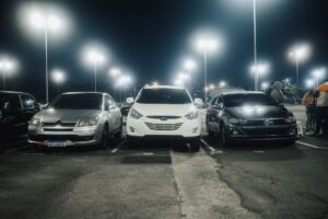 Auto Loan Delinquencies Climb as Used Car Values Keep Sliding Rows of used vehicles parked at a dealership lot