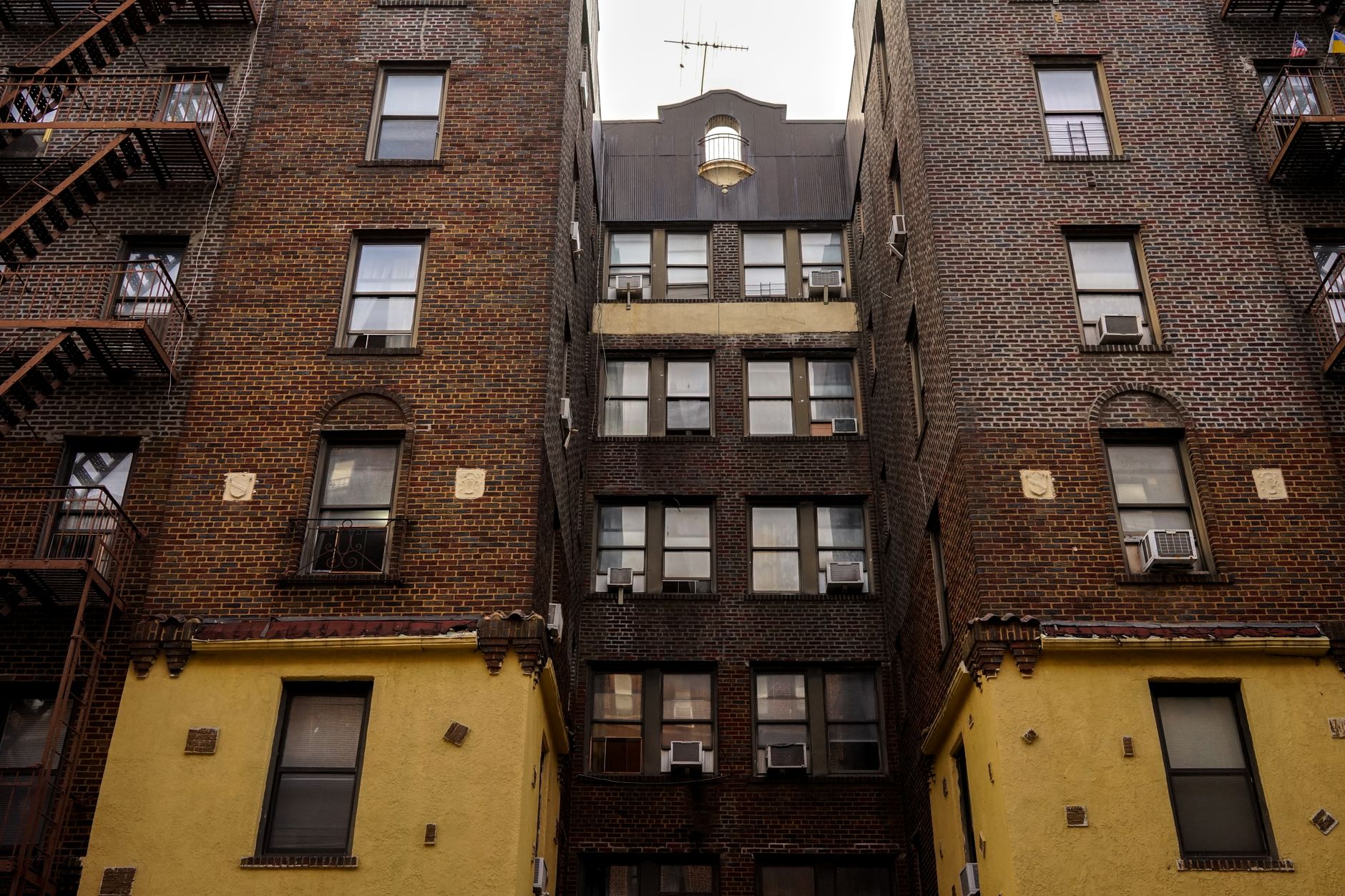 Exterior of a multi-unit residential rental building representing housing instability