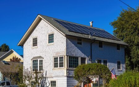 Residential solar panels installed on a suburban home rooftop