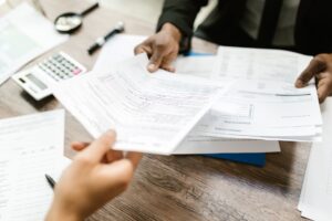 A family reviewing tax documents at a kitchen table