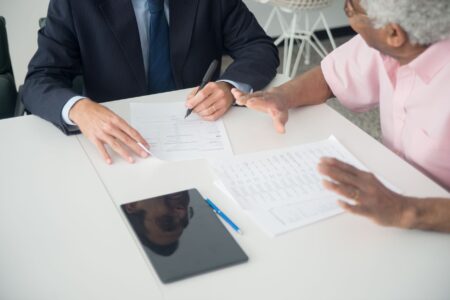Medicare Advantage Overpayments Face Fresh Federal Clawback Push Medicare insurance paperwork and documents spread on a desk
