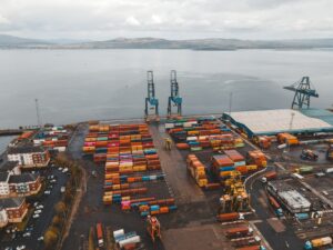 Dock Worker Contract Disputes Stall Port Automation Rollouts Large shipping containers stacked at a busy commercial seaport