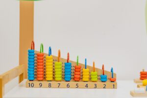 Childcare workers supervising young children in a licensed daycare classroom setting
