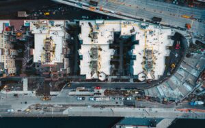 Aerial view of a residential construction site with framed homes in progress