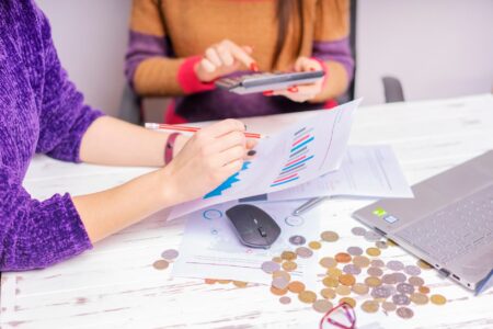 Business team reviewing budget documents in a conference room