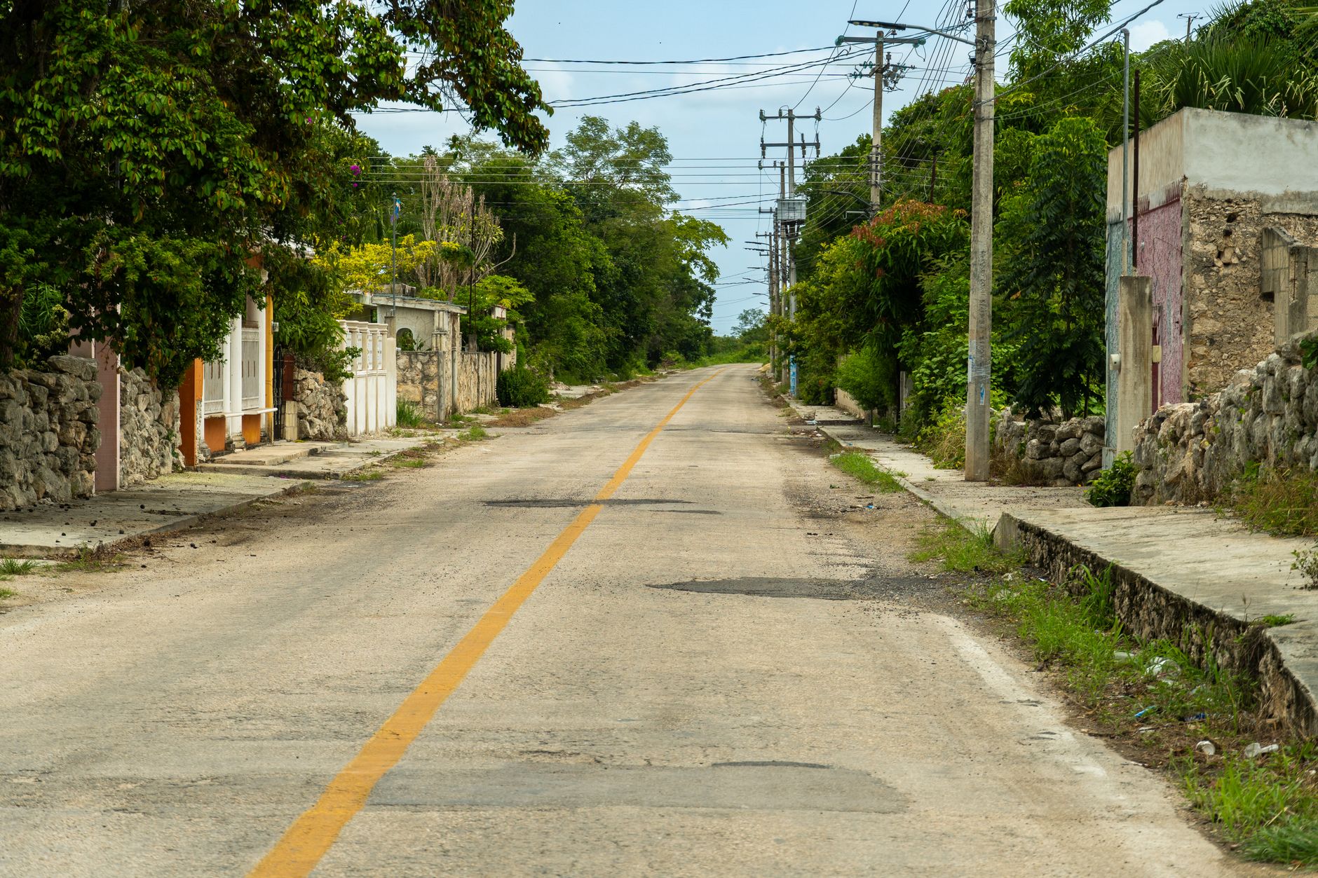 A quiet main street in a small rural American town with limited retail access