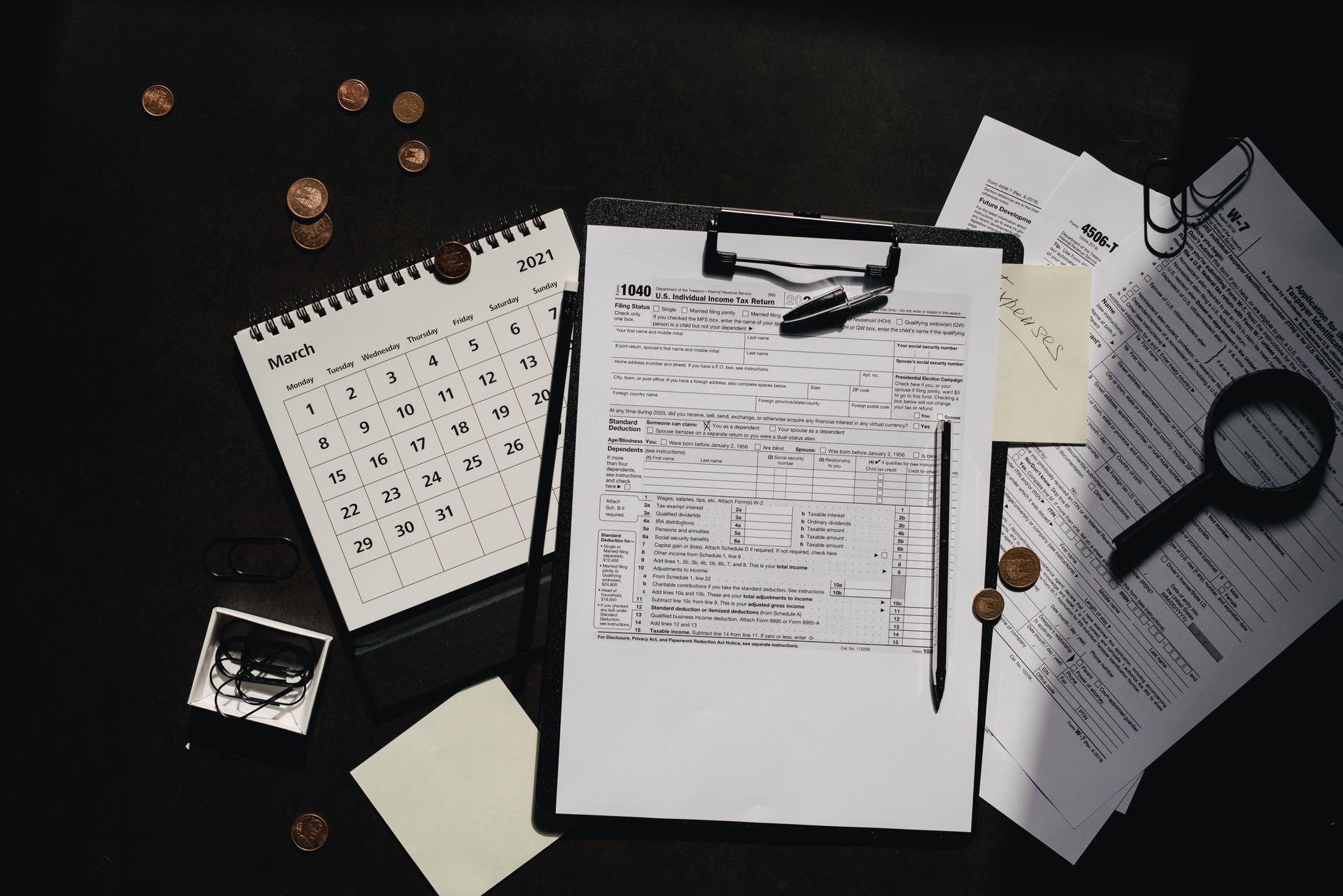 Federal office workers reviewing financial audit documents