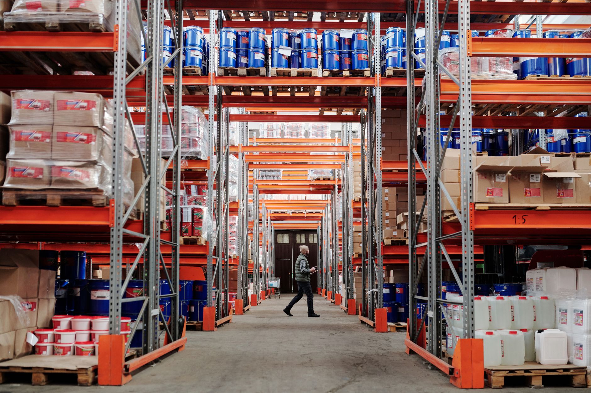 Workers moving inventory in a warehouse representing supply chain cost pressures