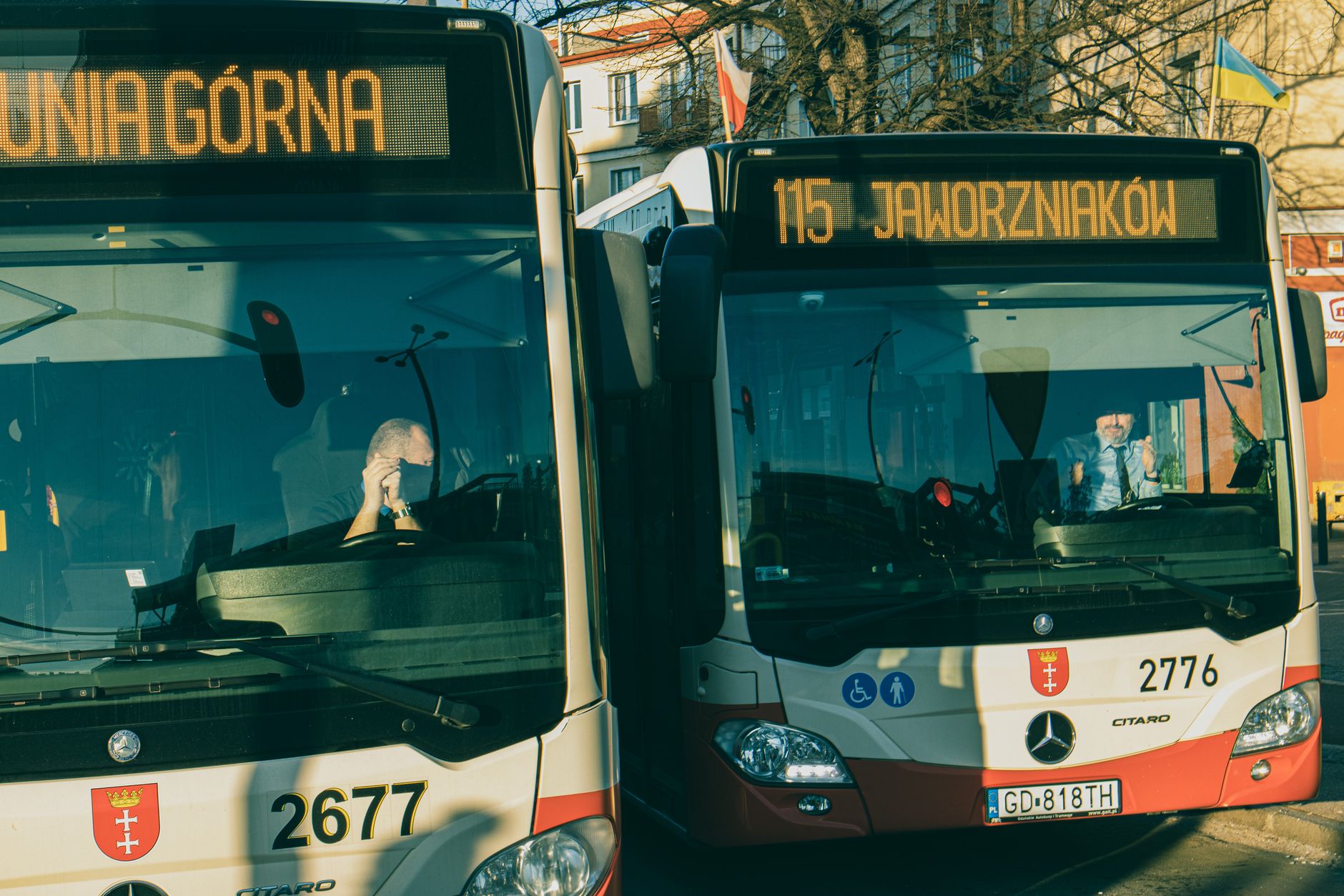 A public transit bus traveling along an urban street route