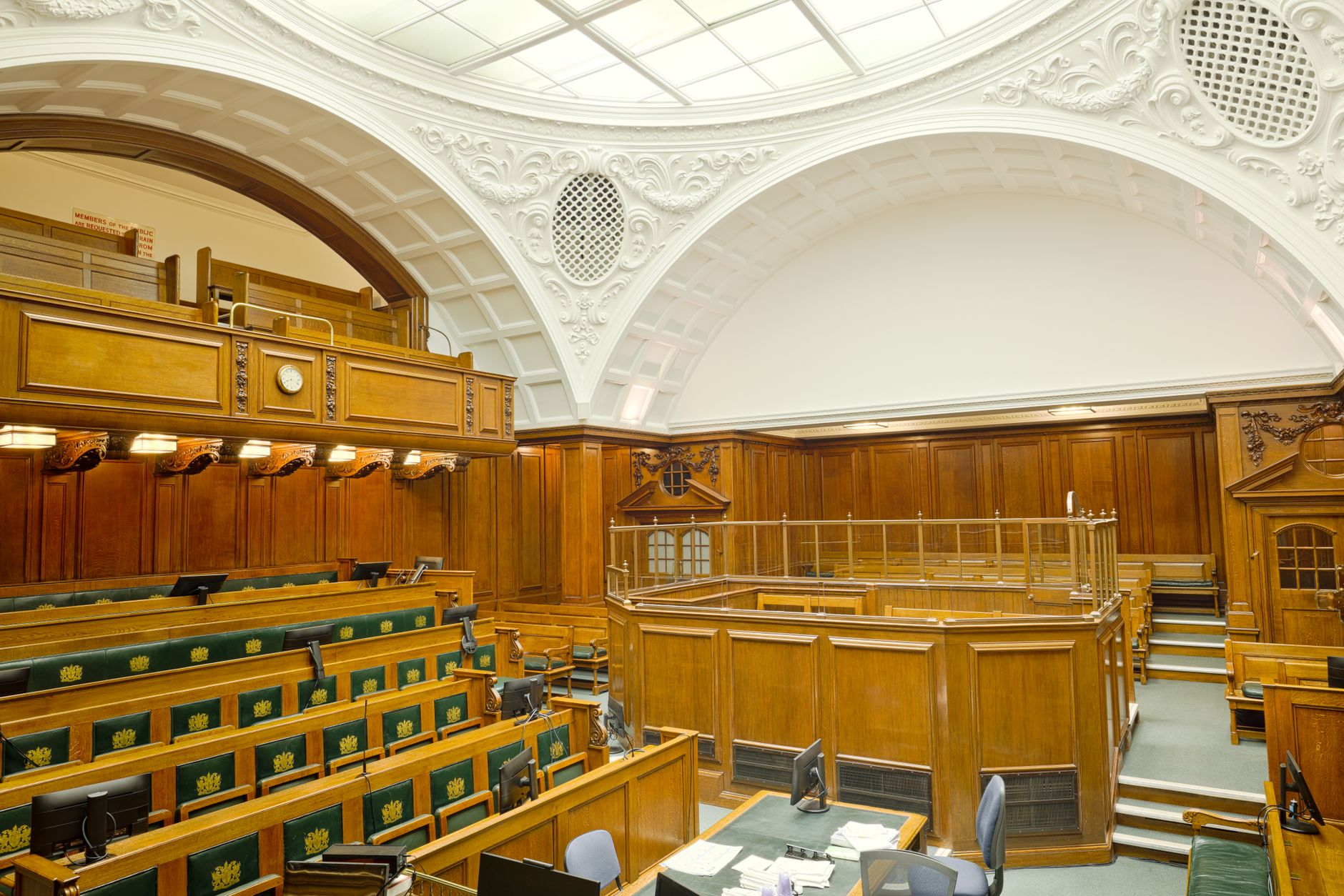 Empty courtroom interior representing DOJ antitrust legal proceedings