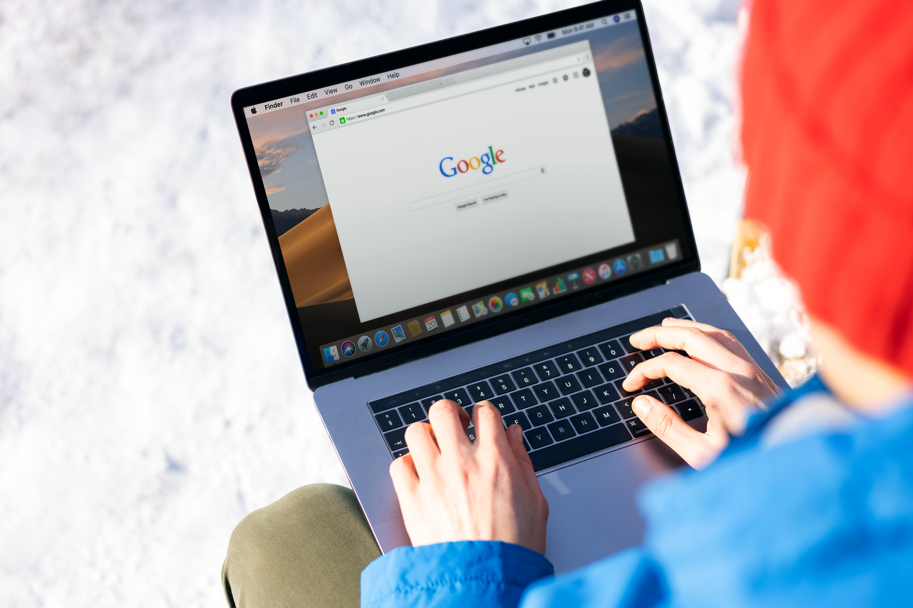Person searching for job openings on a laptop computer