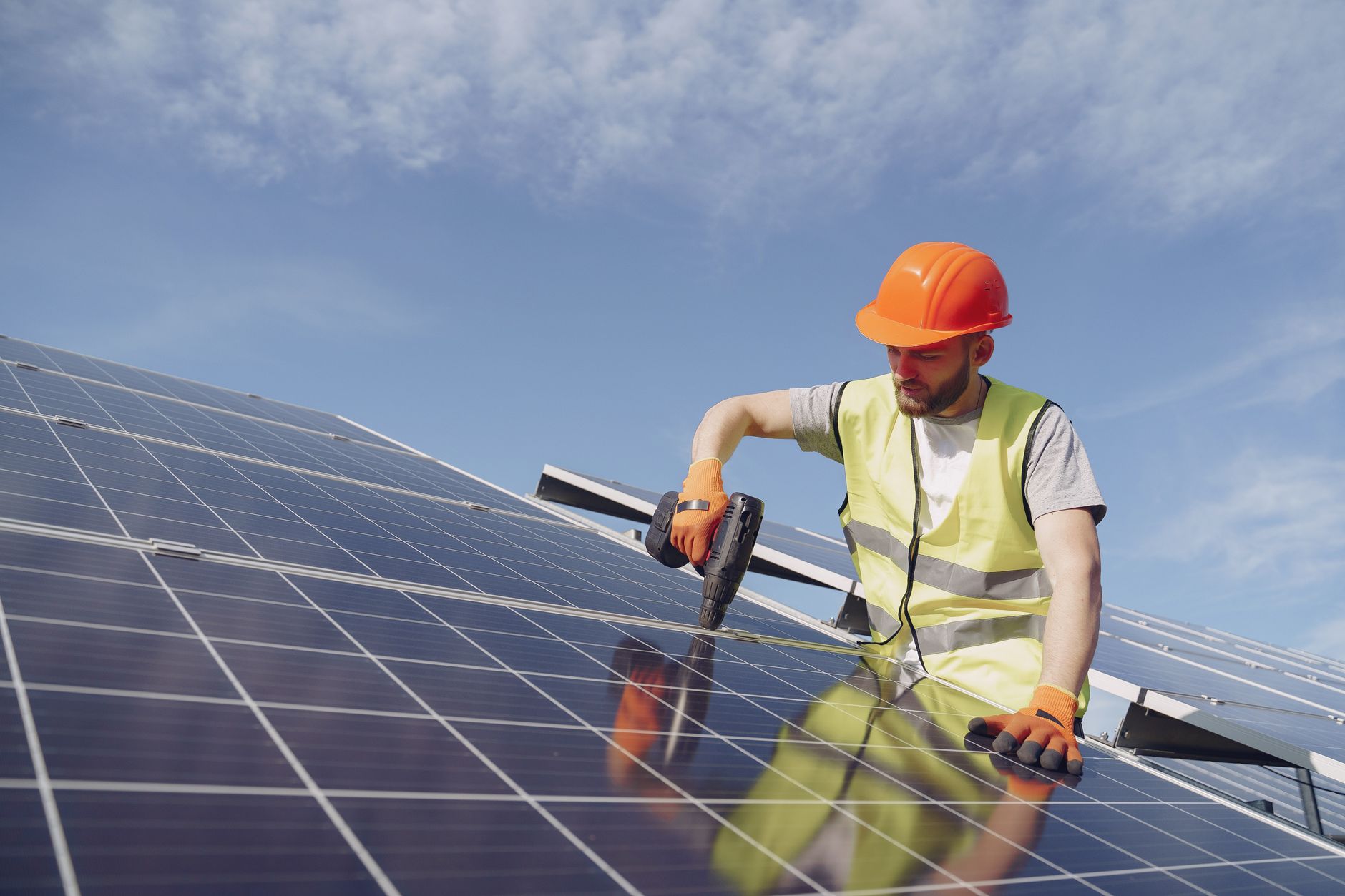 Solar installation worker on a rooftop during a residential installation project