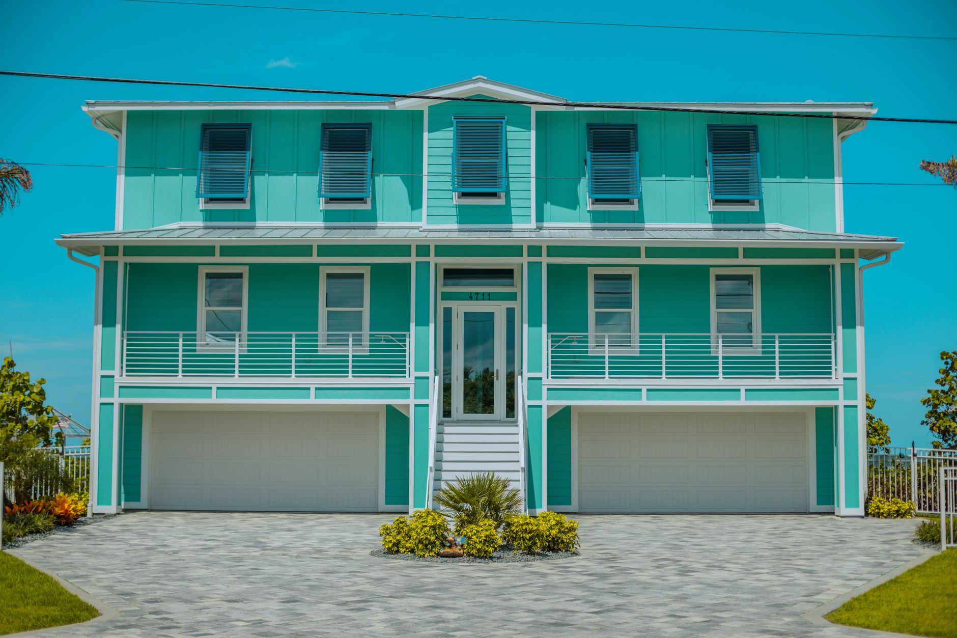 Elevated beach house on a coastal lot with visible storm risk