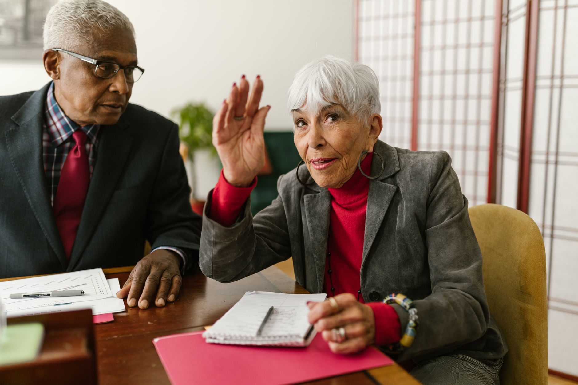 Older public sector worker at desk representing the wave of government retirements