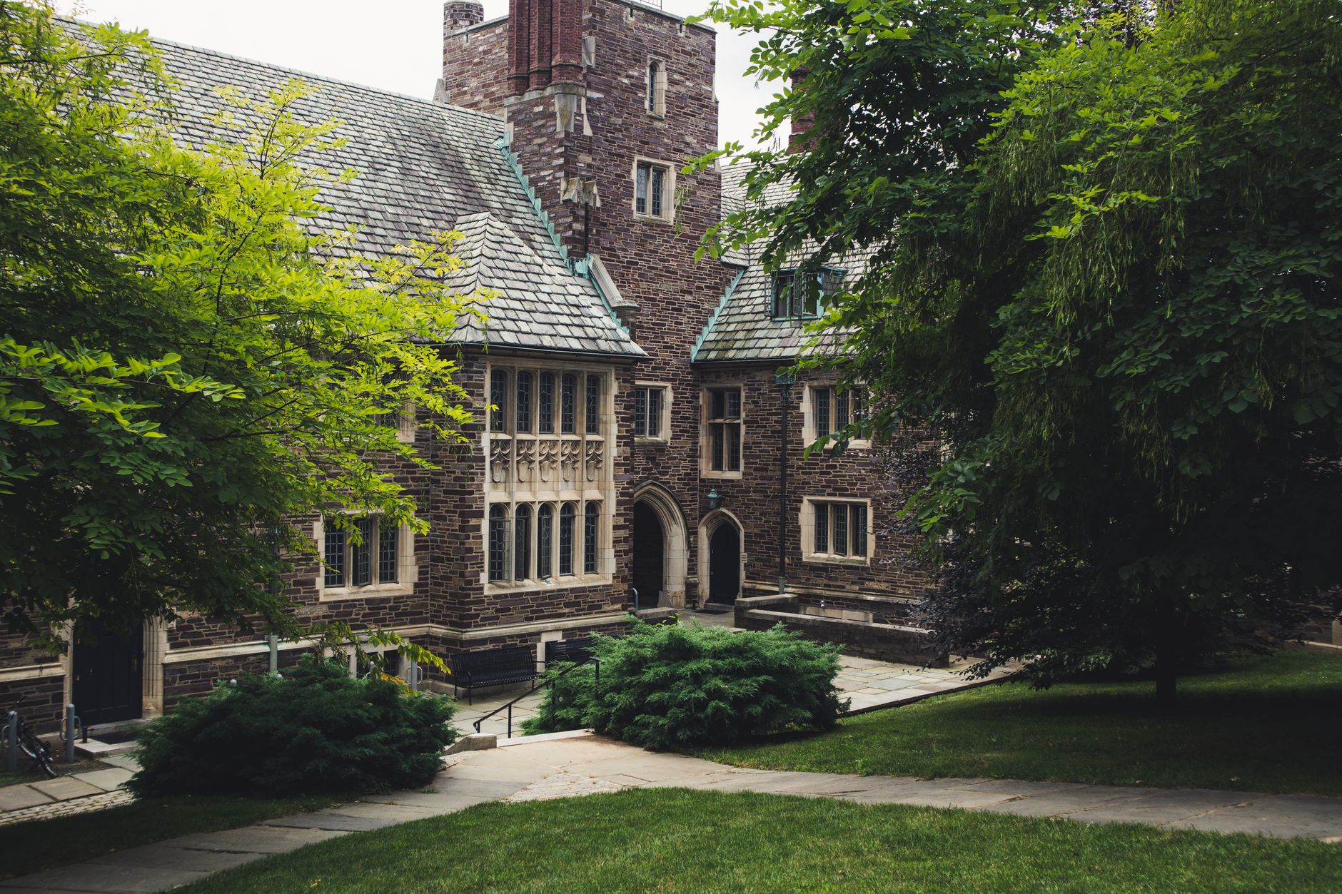 Empty college campus walkway representing student financial strain