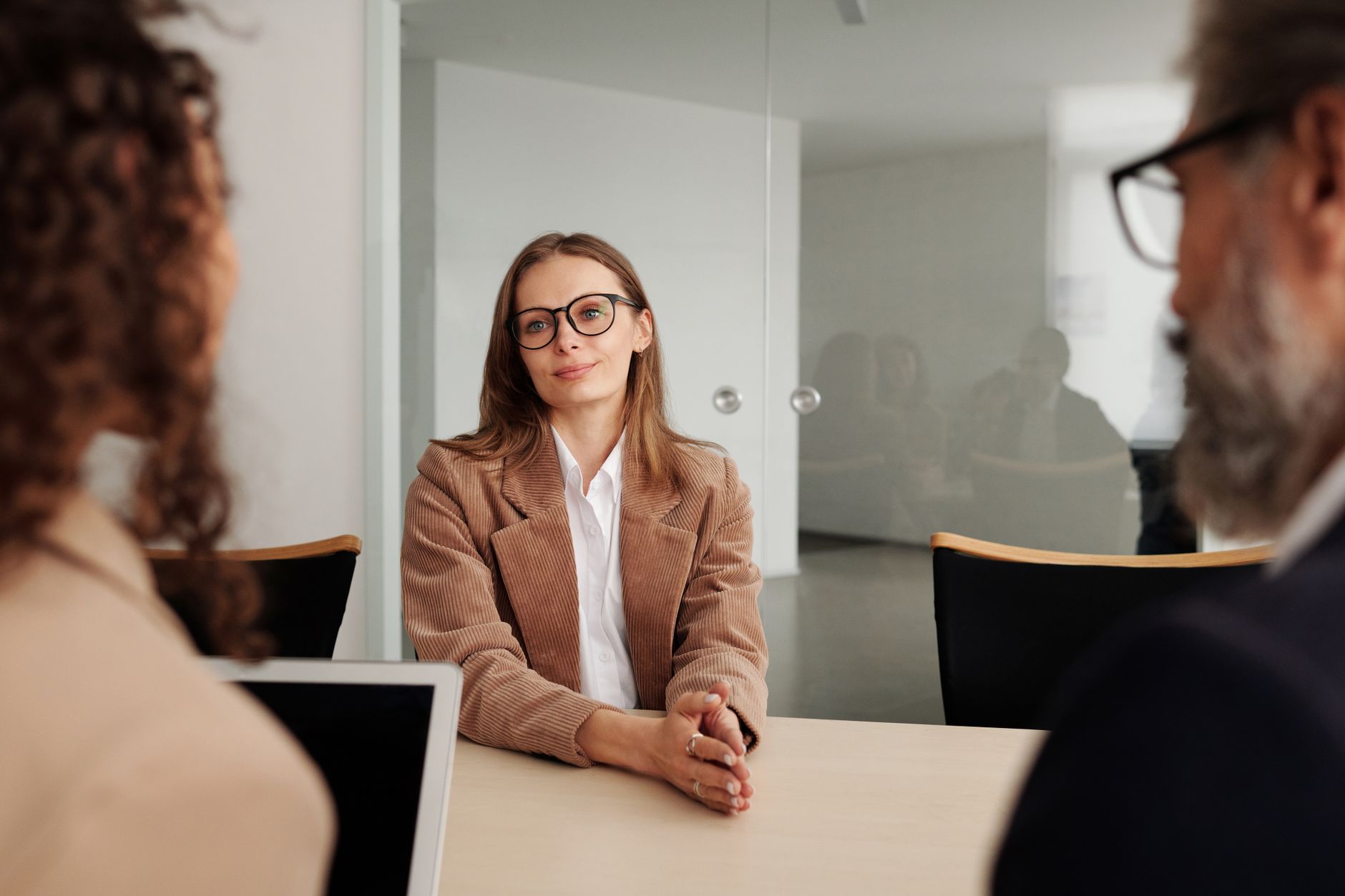Professional job interview setting representing competitive cleared workforce recruitment