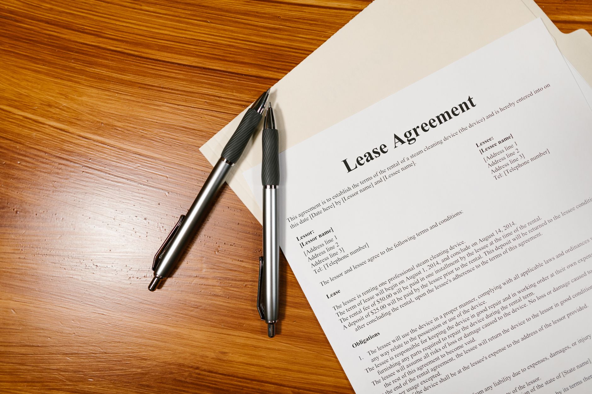 Commercial real estate contract documents on a desk during a negotiation