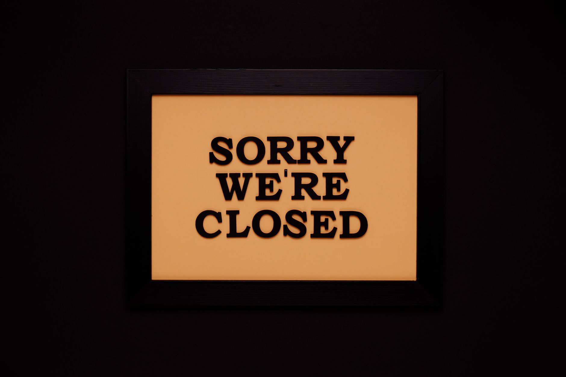 A closed or empty small business storefront reflecting economic hardship