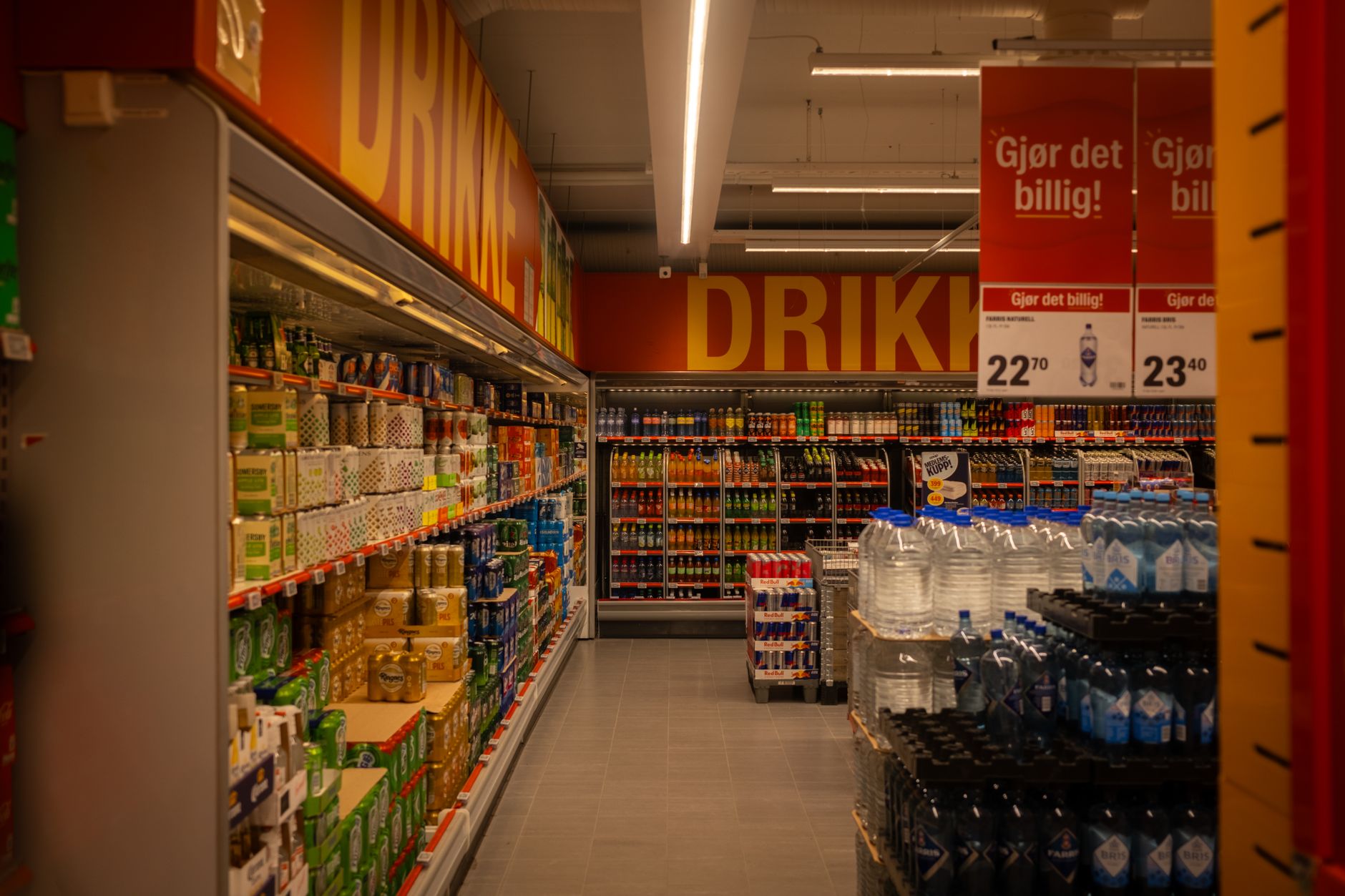 Shopper browsing product options in a grocery store aisle