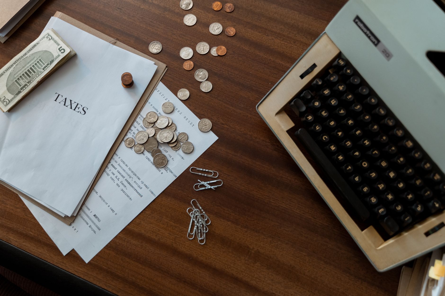 Financial and tax documents spread across a desk representing policy review