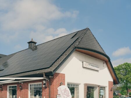 Residential solar panels installed on a rooftop under clear sky