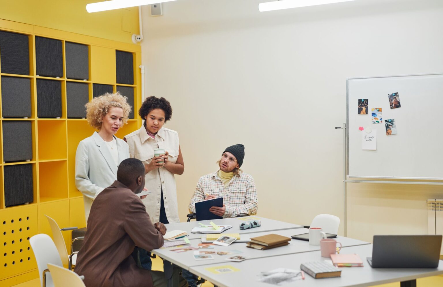 Commercial Insurance Rate Hikes Squeeze Nonprofit Budget Cycles Nonprofit staff reviewing budget documents at a conference table