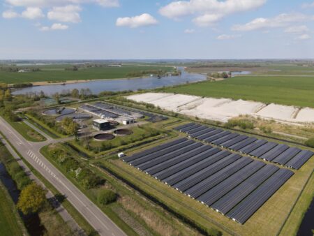 Aerial view of a large solar farm generating renewable energy credits eligible for tax transfer