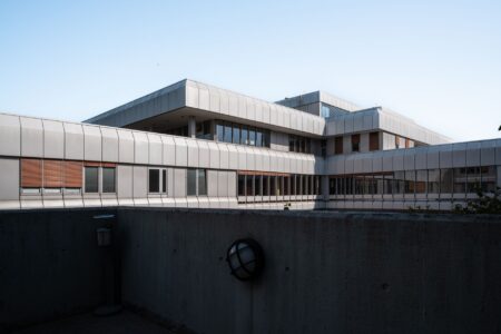 Exterior of a small rural hospital building in a sparsely populated area