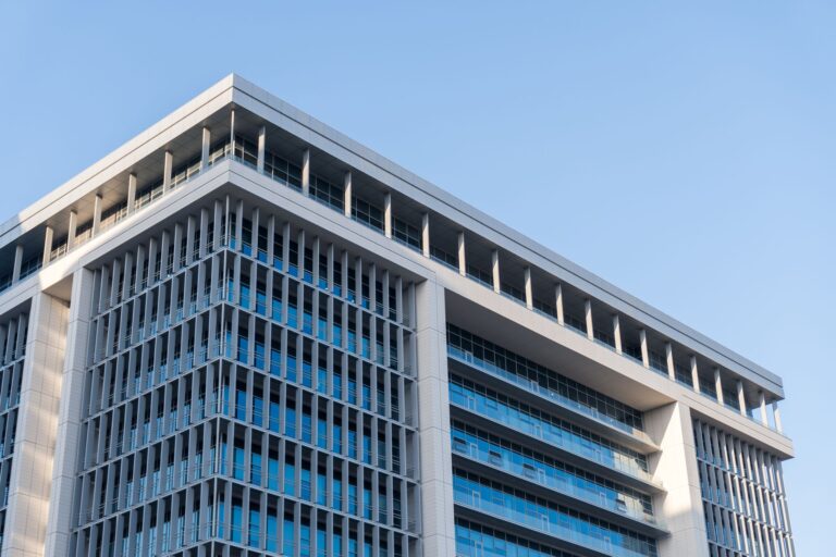 Corporate office building representing companies facing rising debt costs