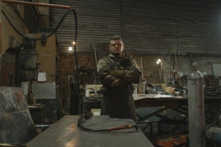 Steelworker operating equipment inside a steel production facility