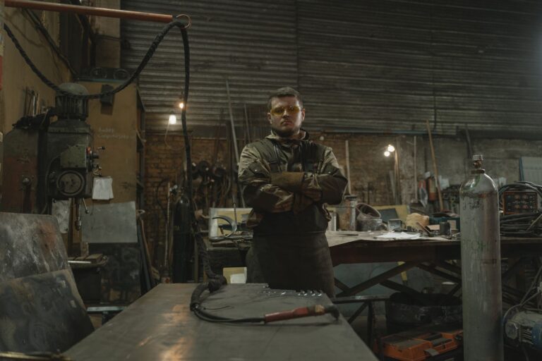 Steelworker operating equipment inside a steel production facility
