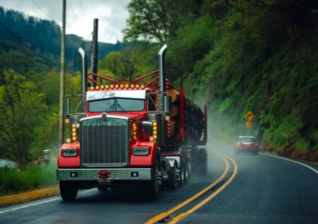 Trucking Spot Rate Collapse Pressures Regional Carrier Survival Semi truck driving on a highway representing trucking industry freight movement